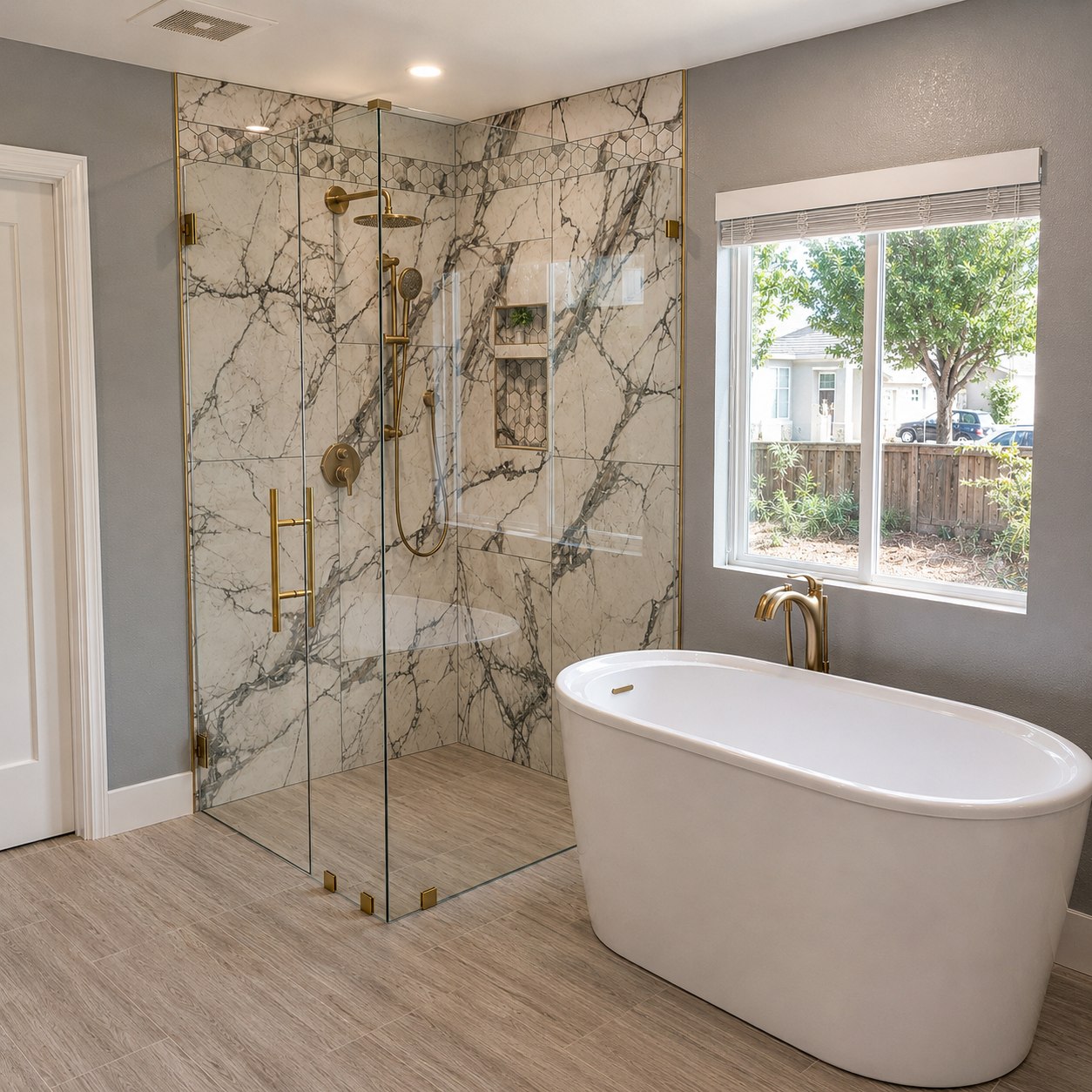 Completed bathroom with a glass shower enclosure and freestanding tub
